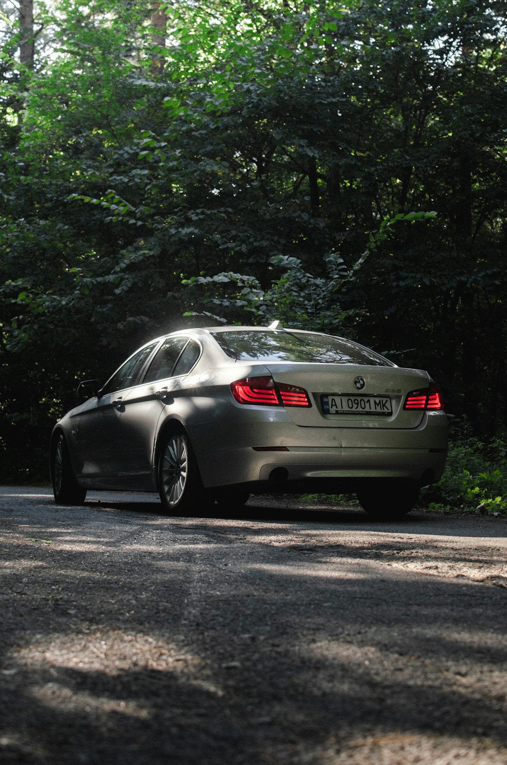 gray bmw coupe on road