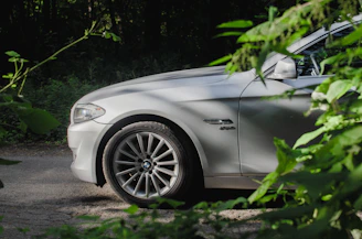 silver car parked on dirt ground