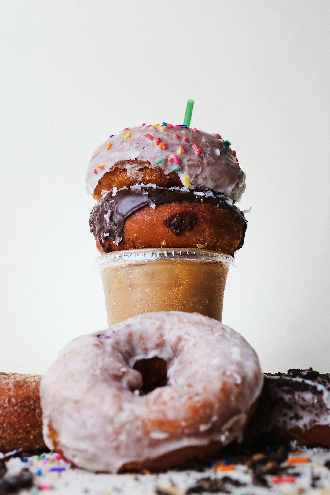 chocolate doughnut with white cream on top