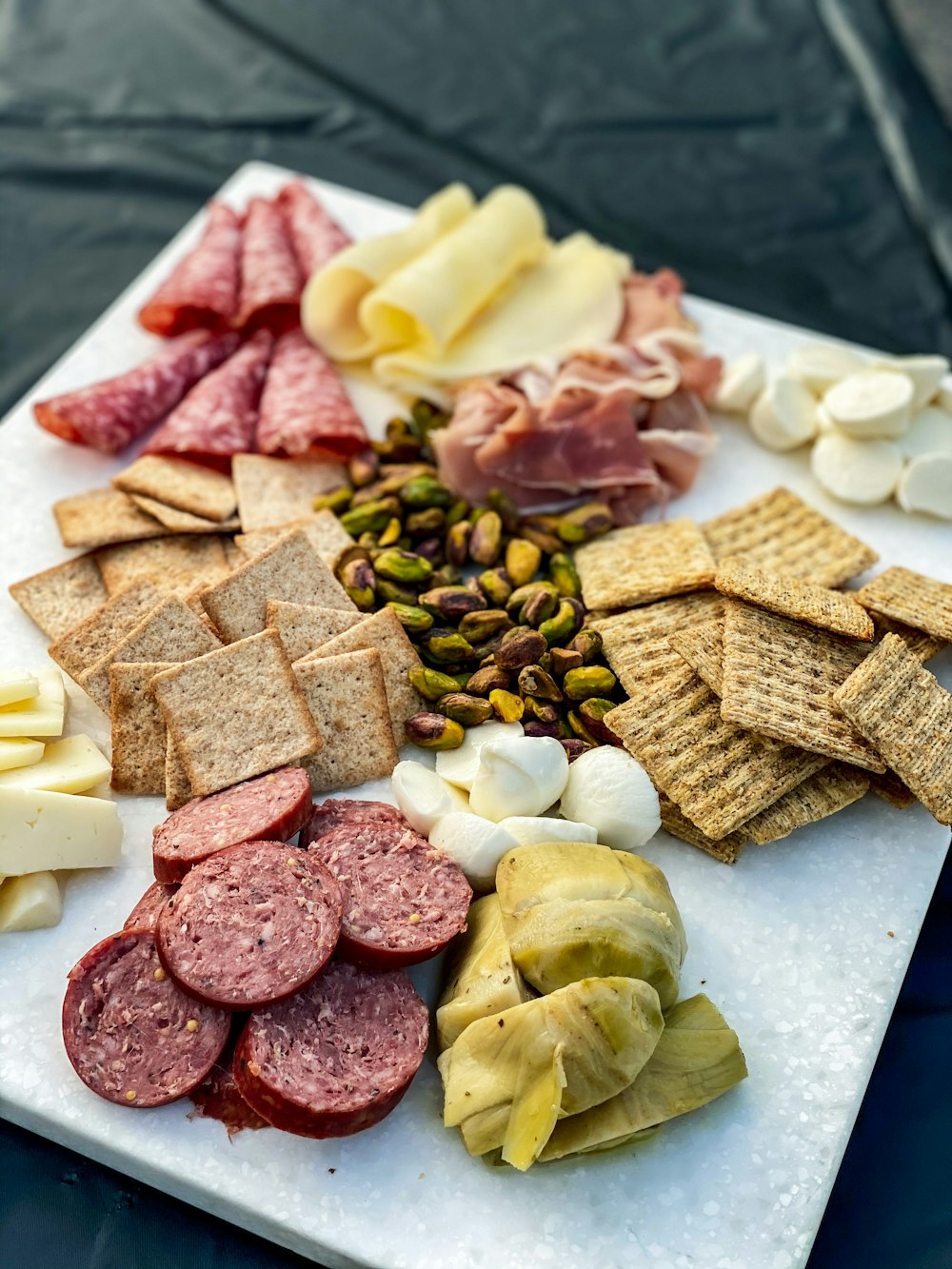 sliced cheese and ham on white ceramic plate