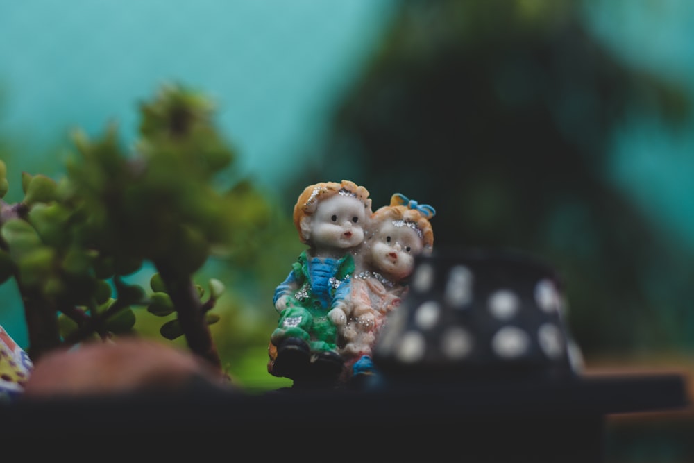 white and blue ceramic figurine