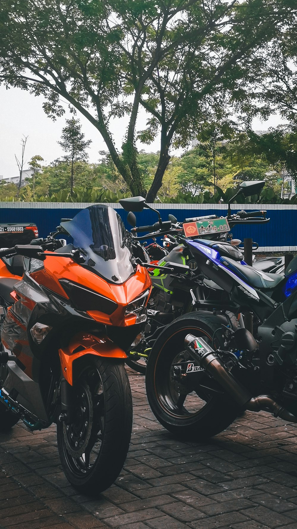 orange and black sports bike