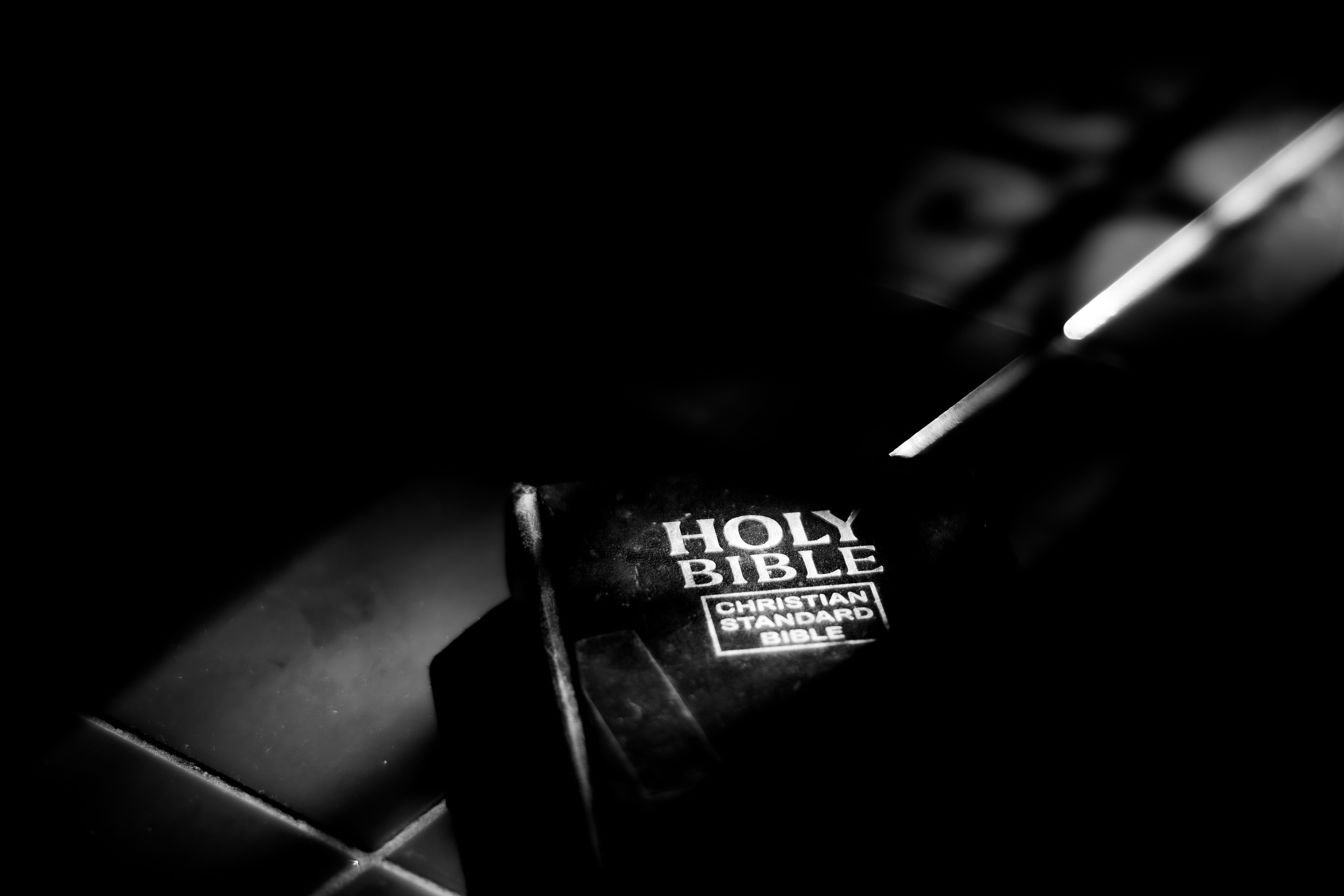 a black and white photo of a bible