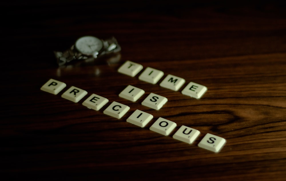 white and black wooden letter blocks