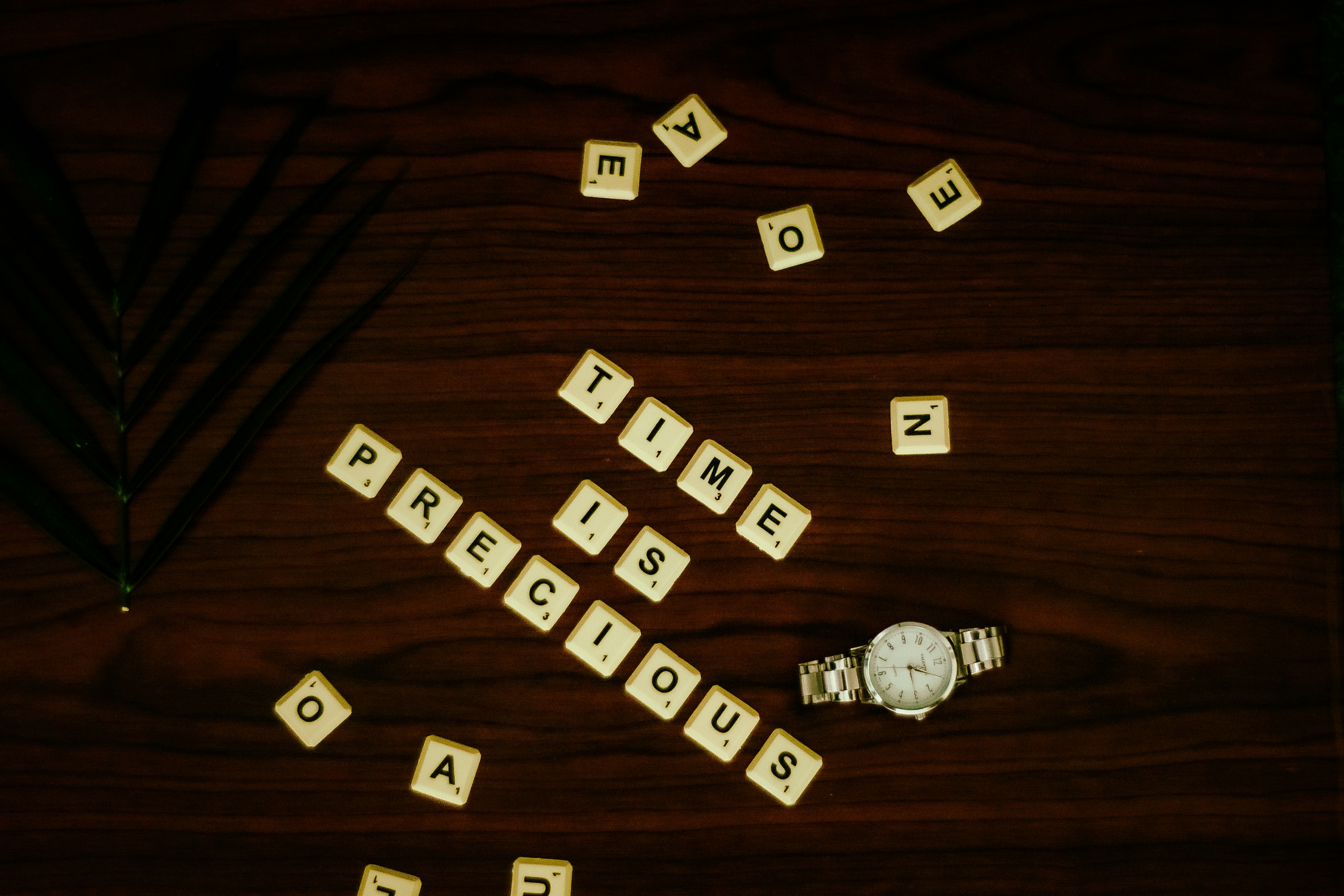 white and black letter blocks on brown wooden table