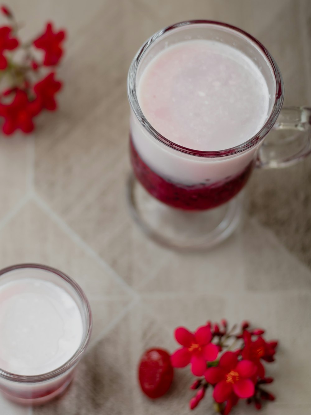 clear glass mug with red liquid