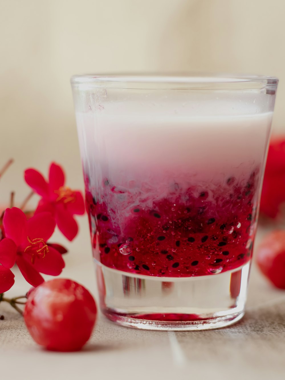 red liquid in clear drinking glass