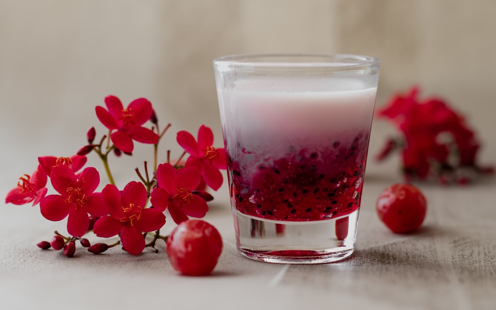 red liquid in clear drinking glass