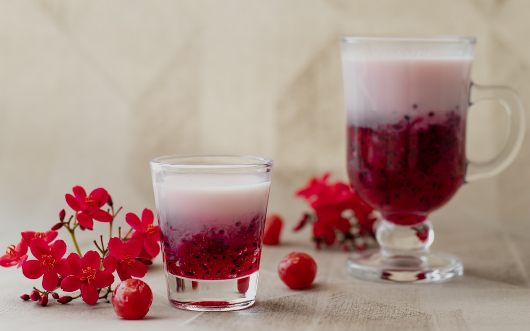 clear glass cup with red liquid