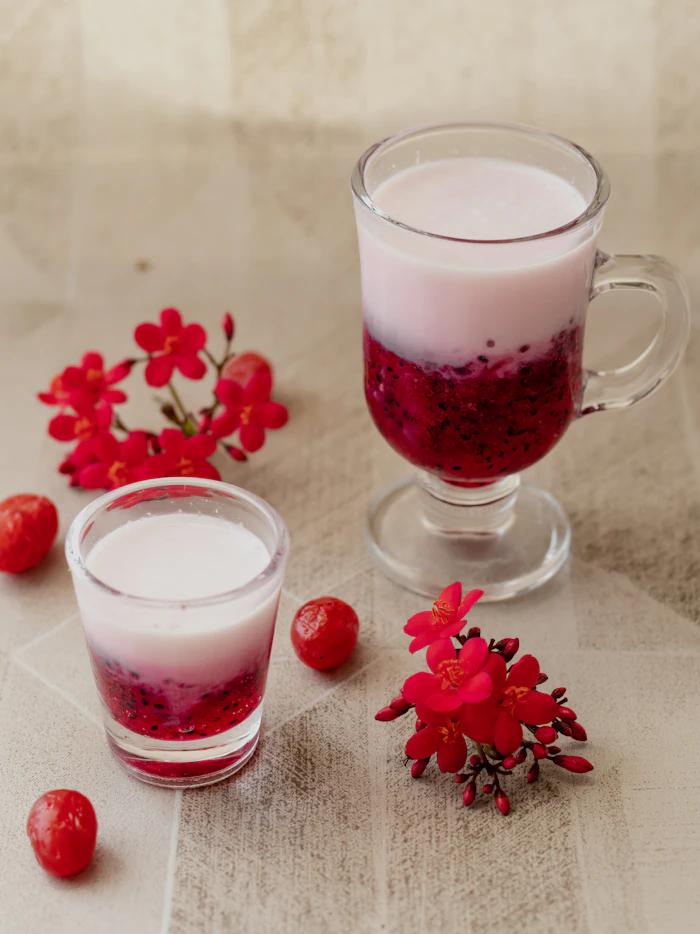 A layered rose falooda in a tall glass
