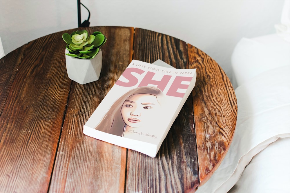 white book on brown wooden round table