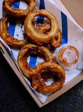 onion rings on white paper