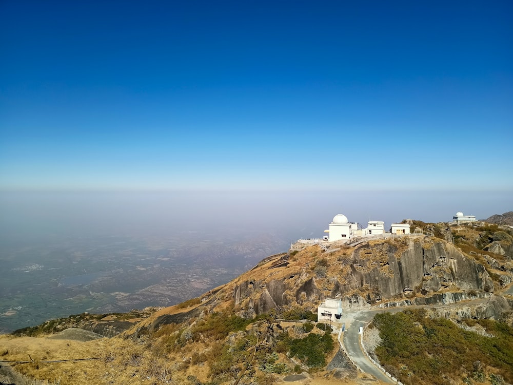 white concrete building on top of mountain during daytime