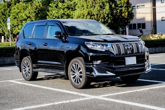 blue audi suv on road during daytime