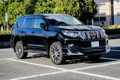 blue audi suv on road during daytime