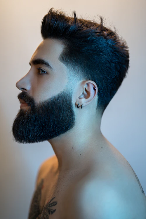 Short textured spiky fade with a full beard