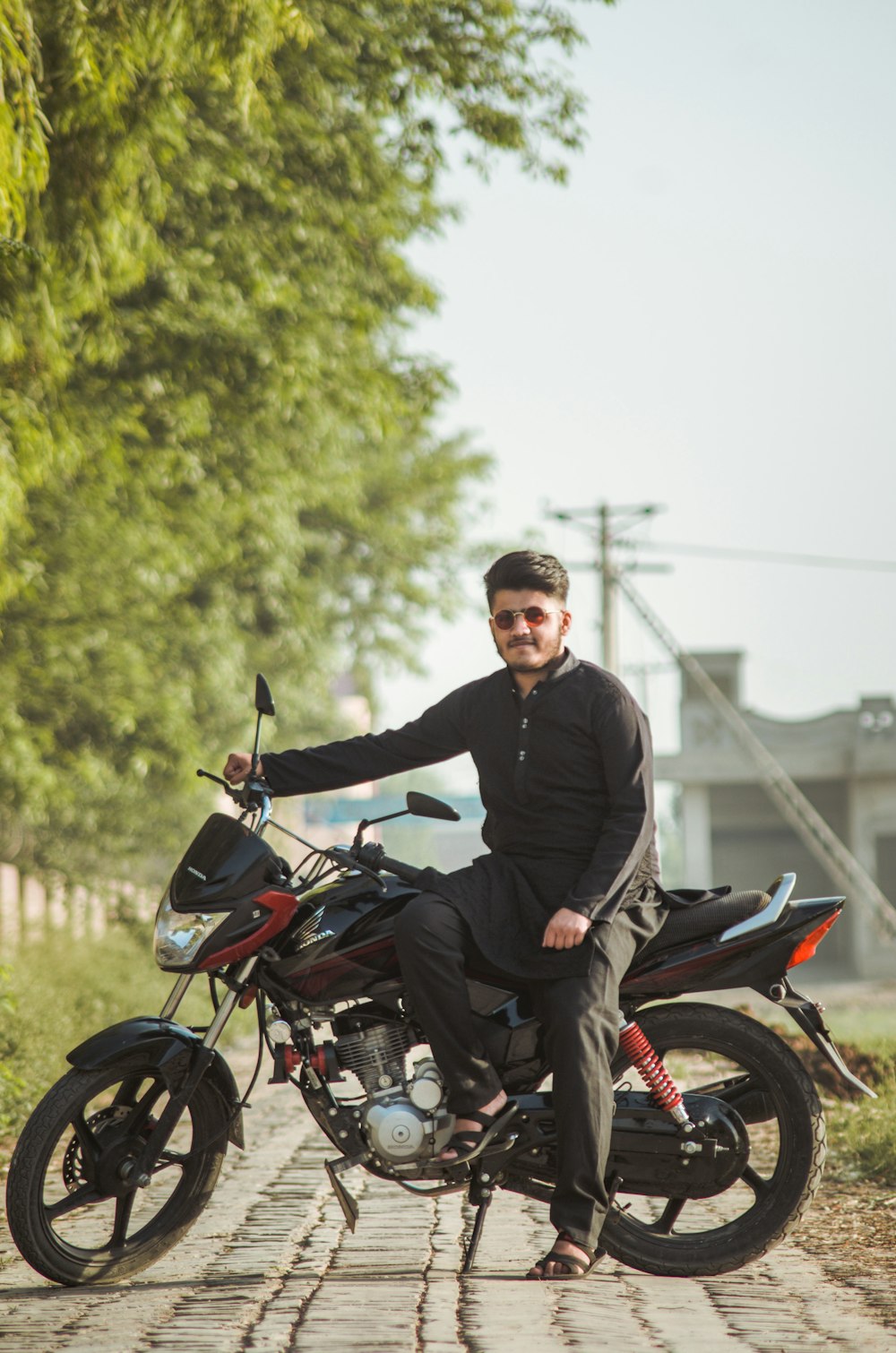man in black jacket riding motorcycle during daytime