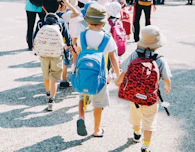 people walking on gray concrete road during daytime