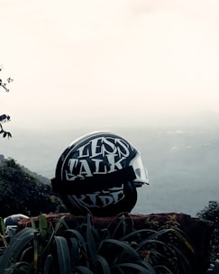 A close-up of a biker helmet resting on a motorcycle seat, symbolizing adventure and safety.