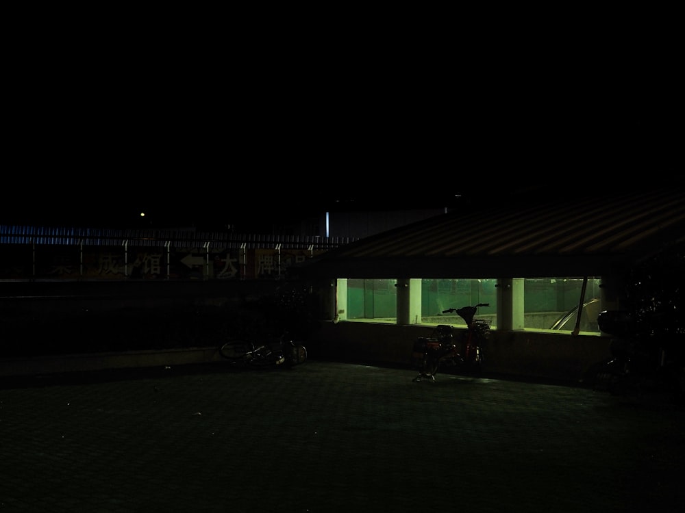 green and white shed during night time