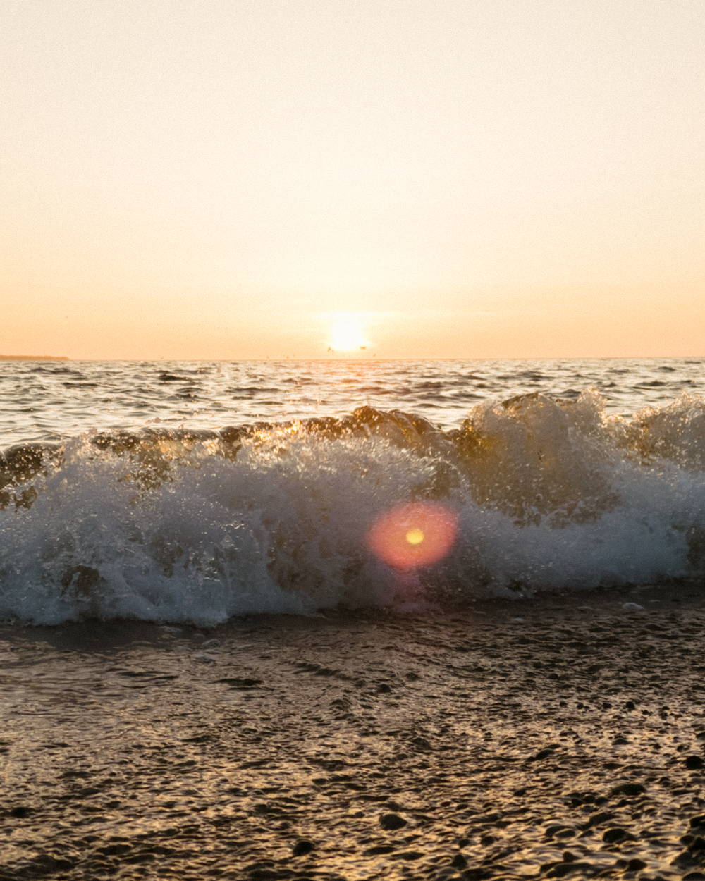 ocean waves crashing on shore during daytime