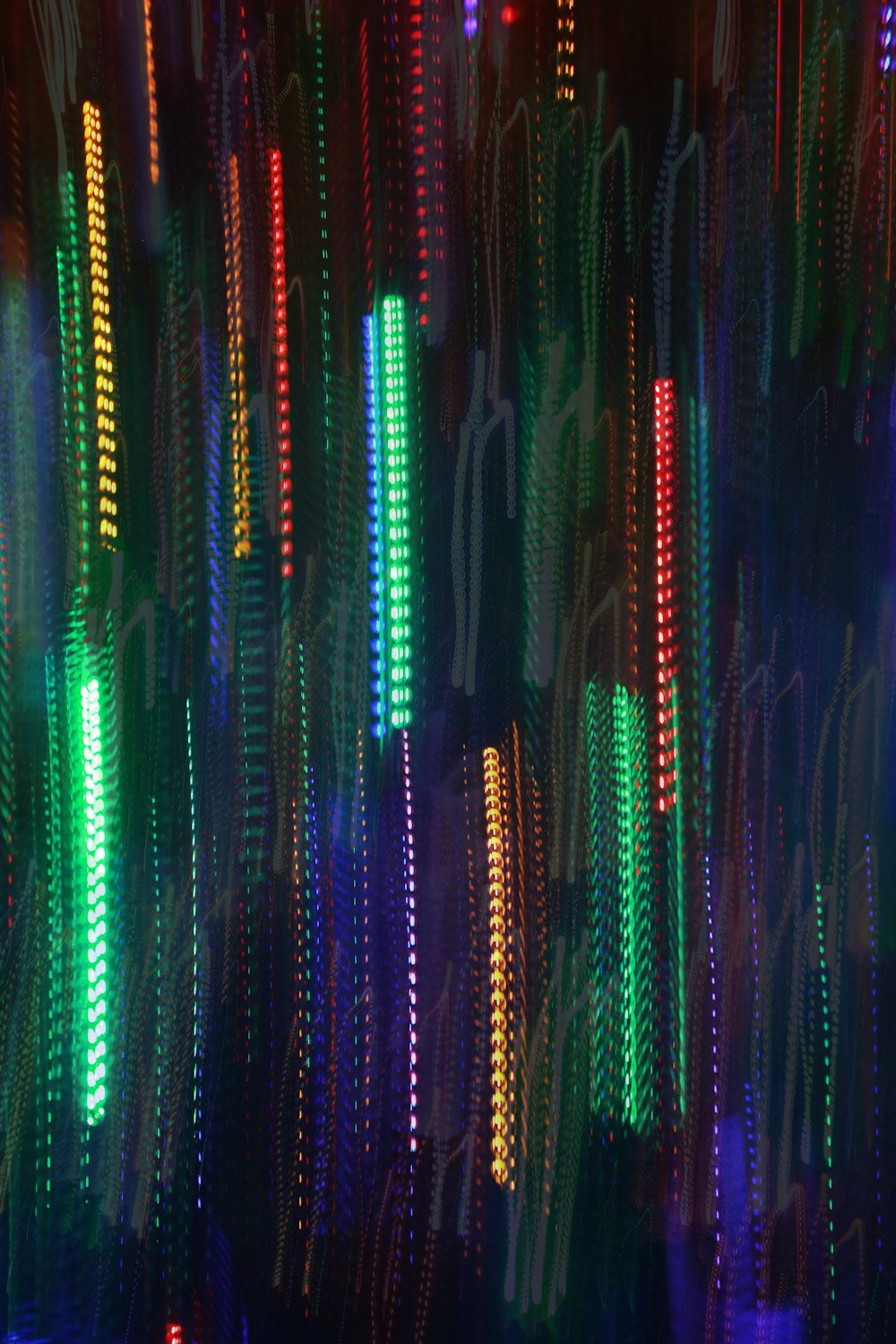a colorful display of lights in a dark room