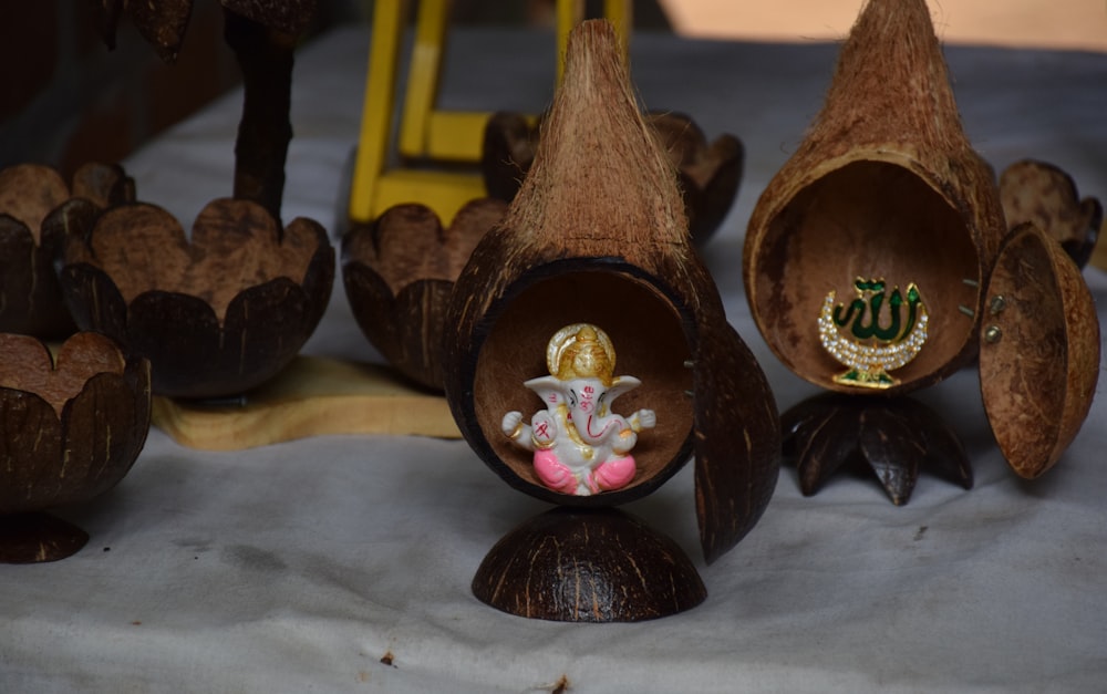 brown wooden bird house on white textile