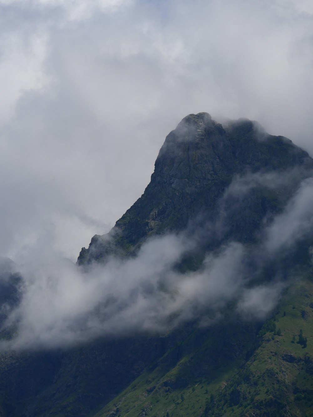 gray and green mountain under white clouds