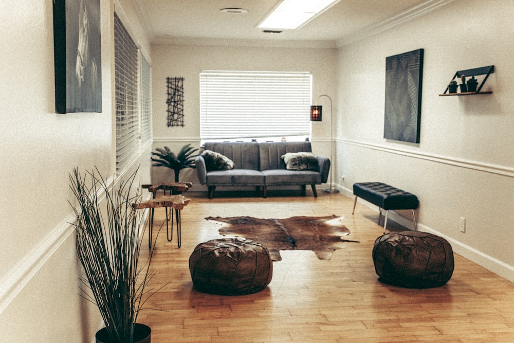 black leather sofa near brown wooden coffee table