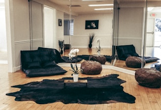 black sofa near brown wooden coffee table