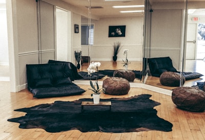 black sofa near brown wooden coffee table