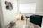 A peaceful, softly lit therapy room with comfortable cushions and gentle natural elements.