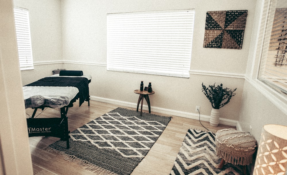 brown wooden table on brown and white area rug