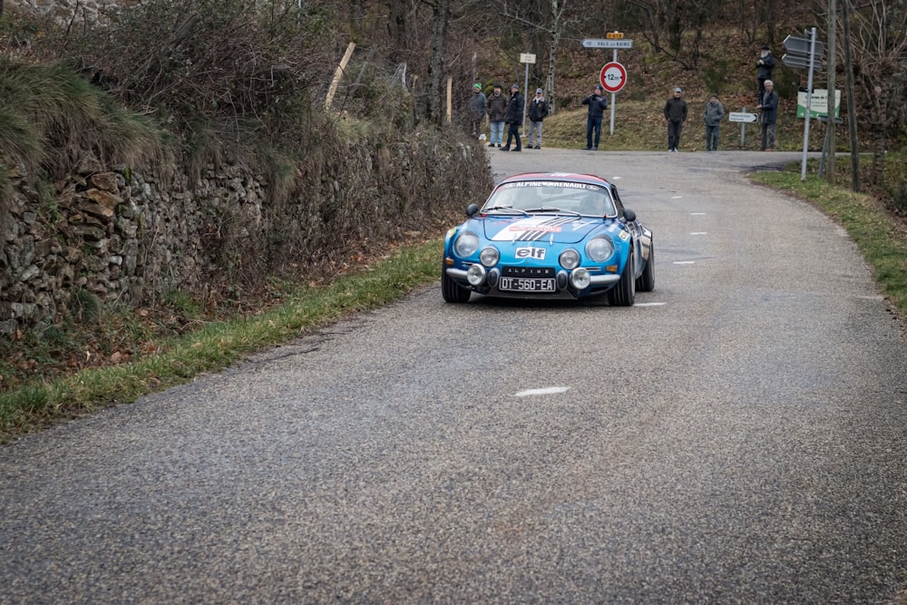 blue porsche 911 on road during daytime