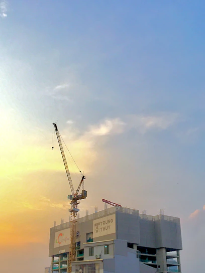 A vibrant construction site showcasing a tensile architecture project in progress under a bright sky.