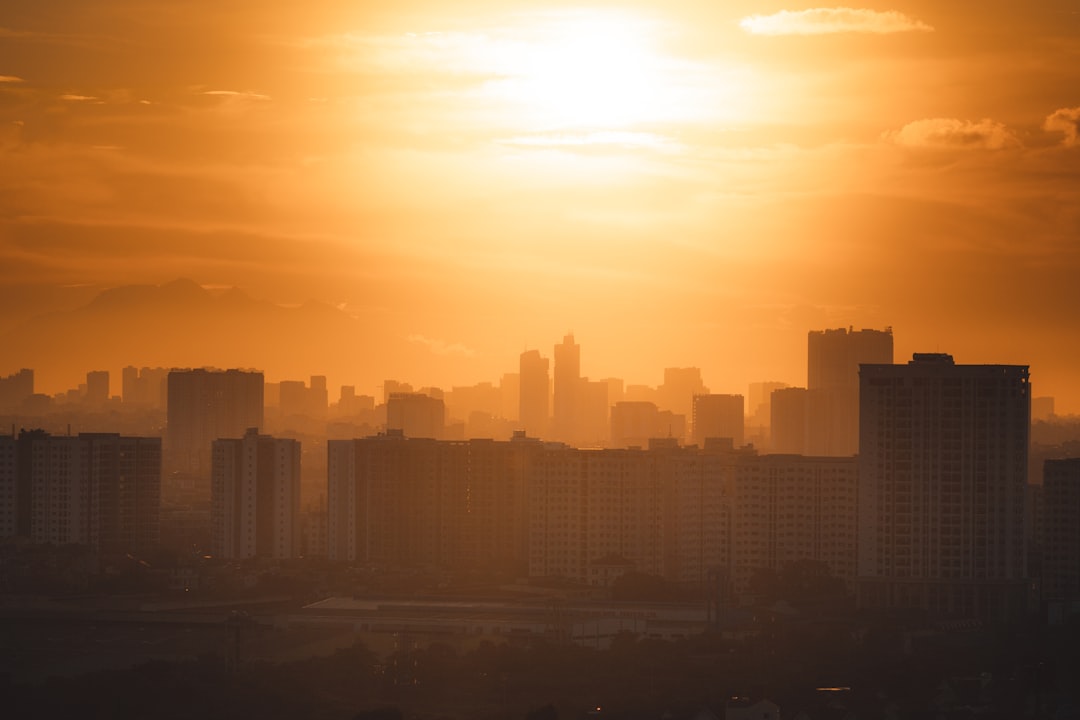 silhouette of city buildings during sunset