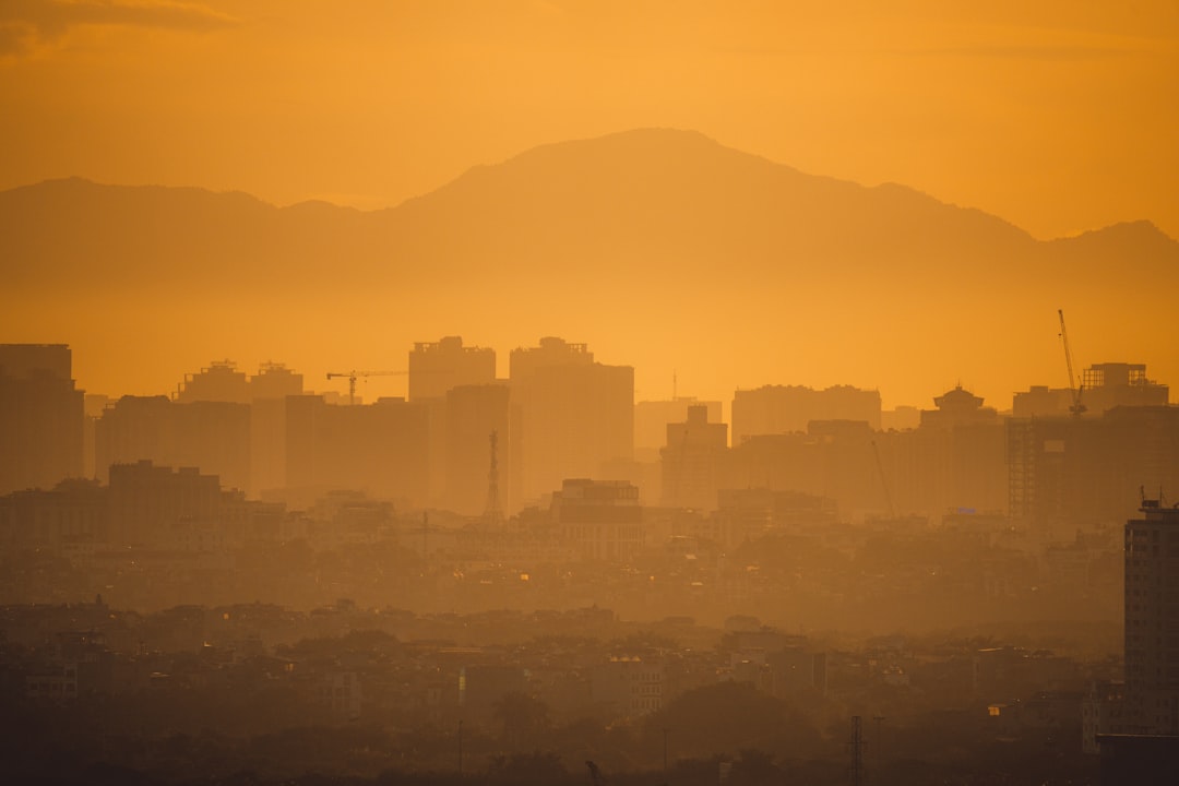 silhouette of city building during sunset