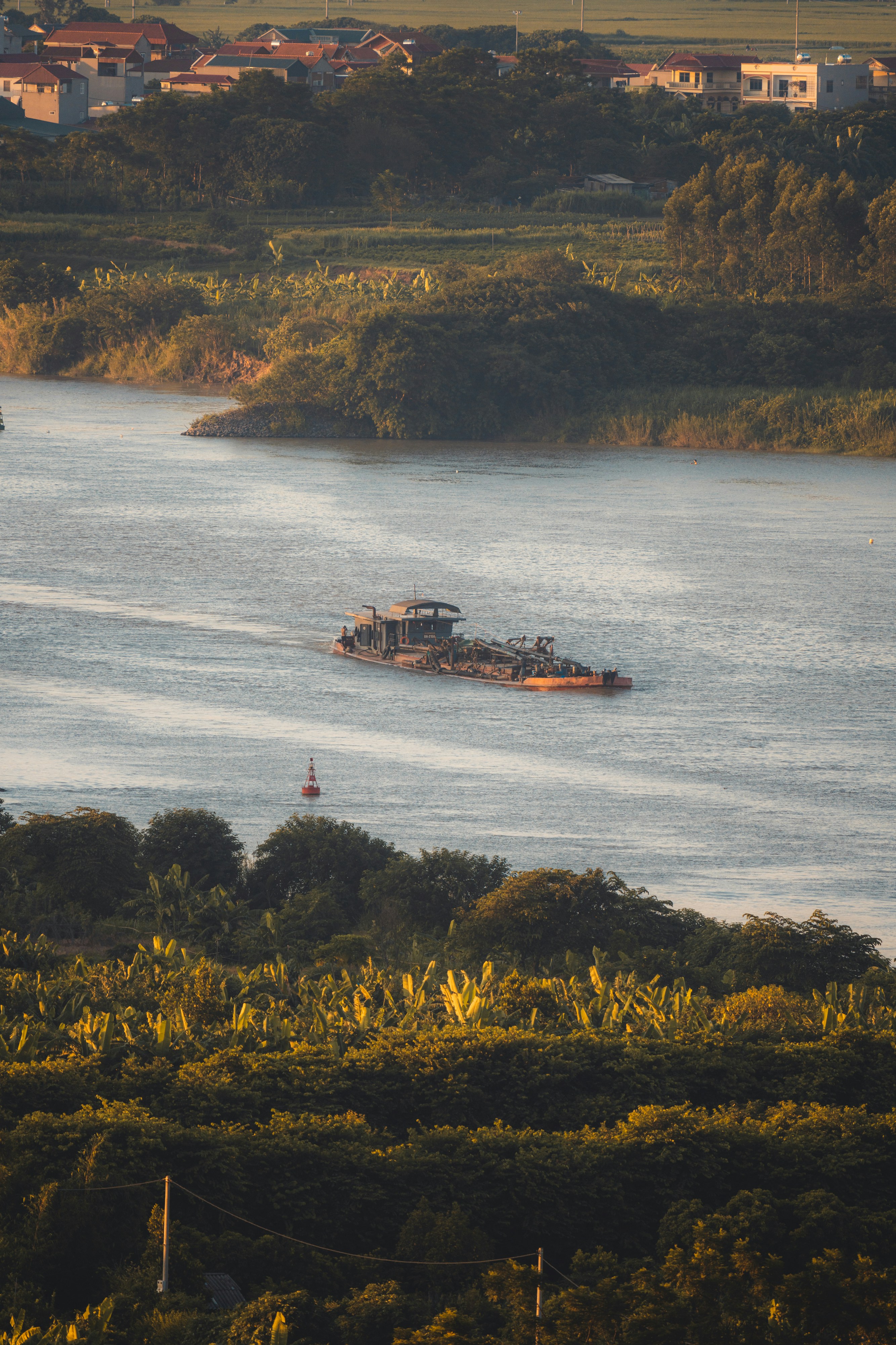 white and brown boat on body of water during daytime
