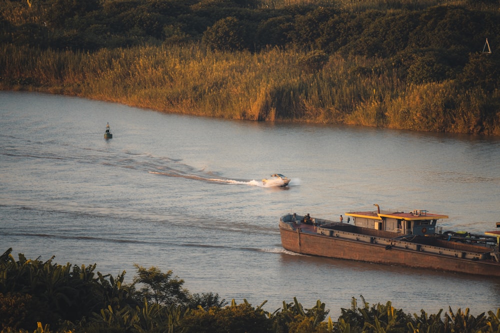 brown ship on body of water during daytime