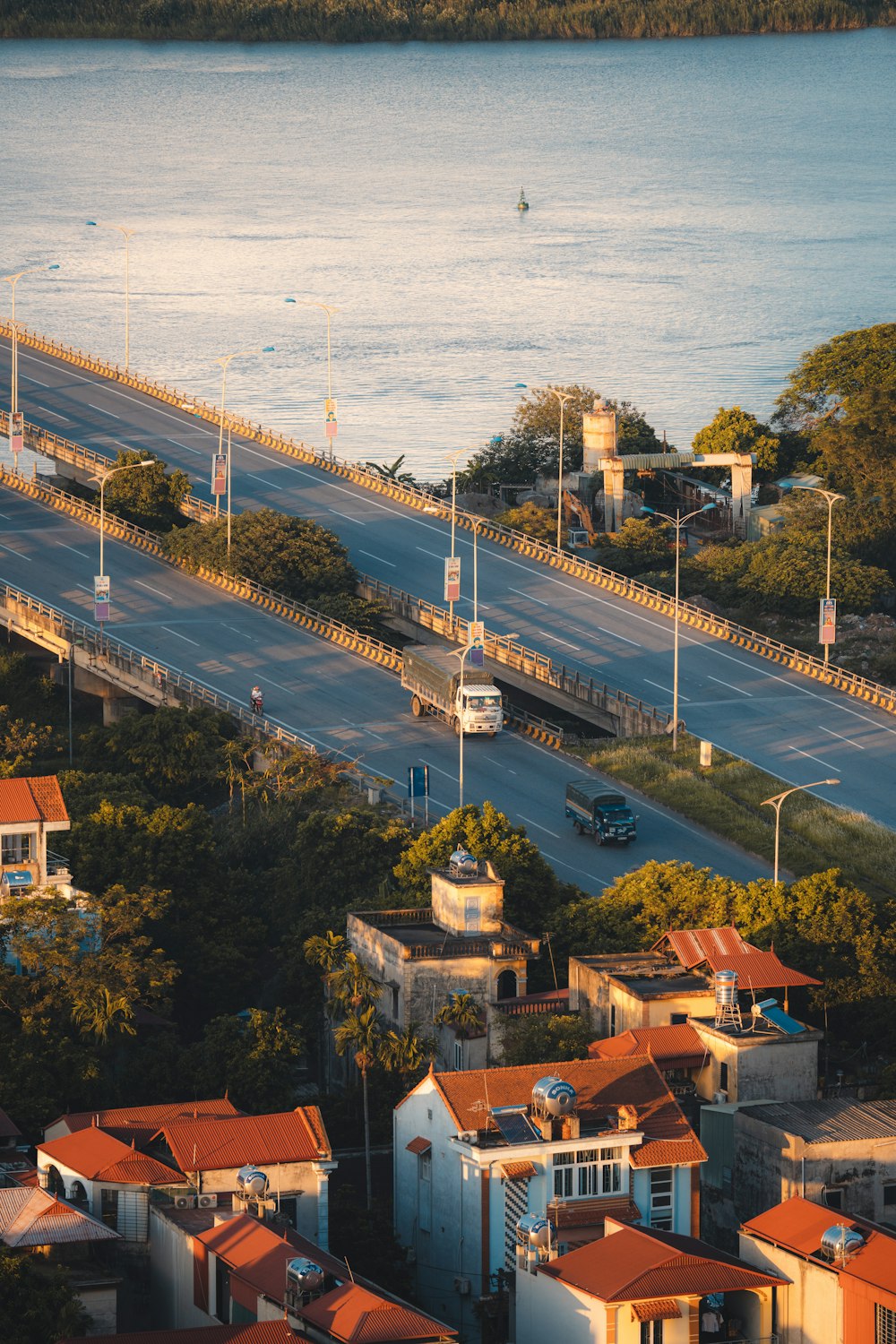 aerial view of city buildings near body of water during daytime