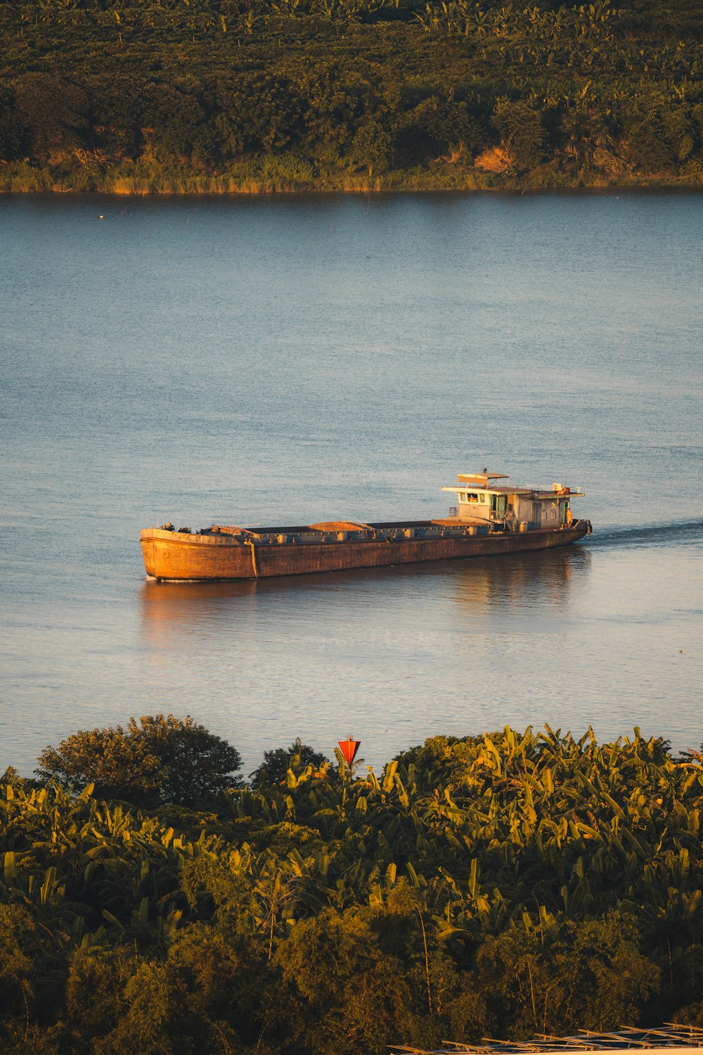 brown ship on body of water during daytime