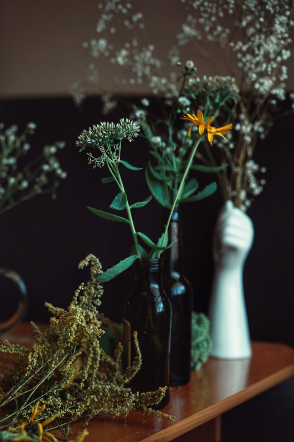 yellow flowers in white ceramic vase