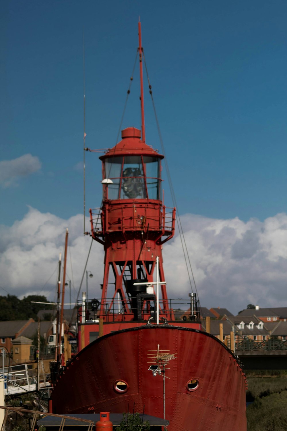 red and white tower under blue sky