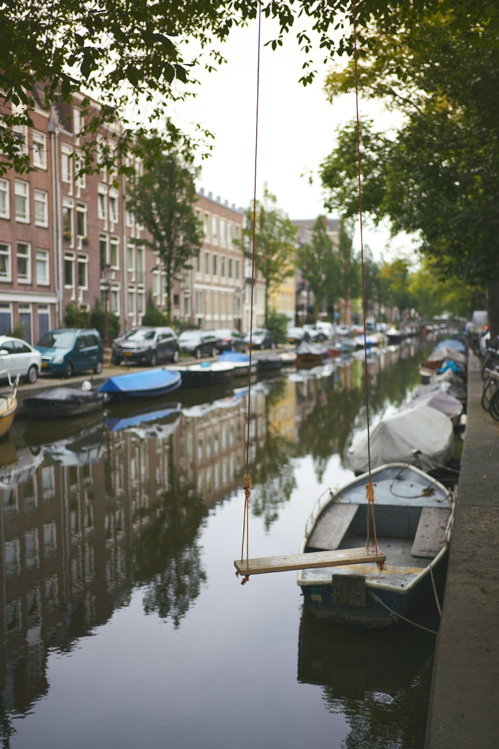 boat on water near buildings during daytime