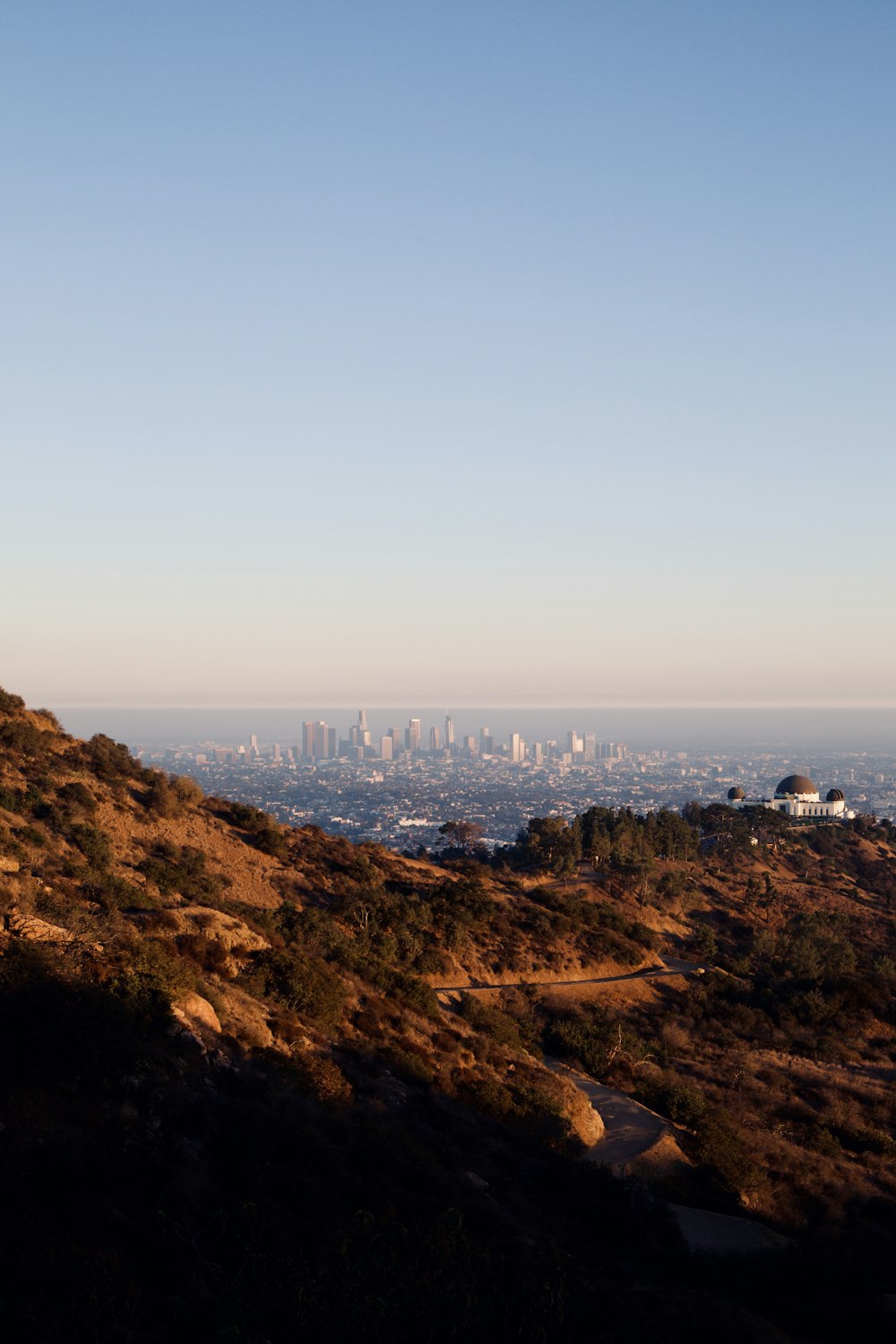 aerial view of city buildings on mountain during daytime