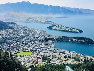 aerial view of city near body of water during daytime