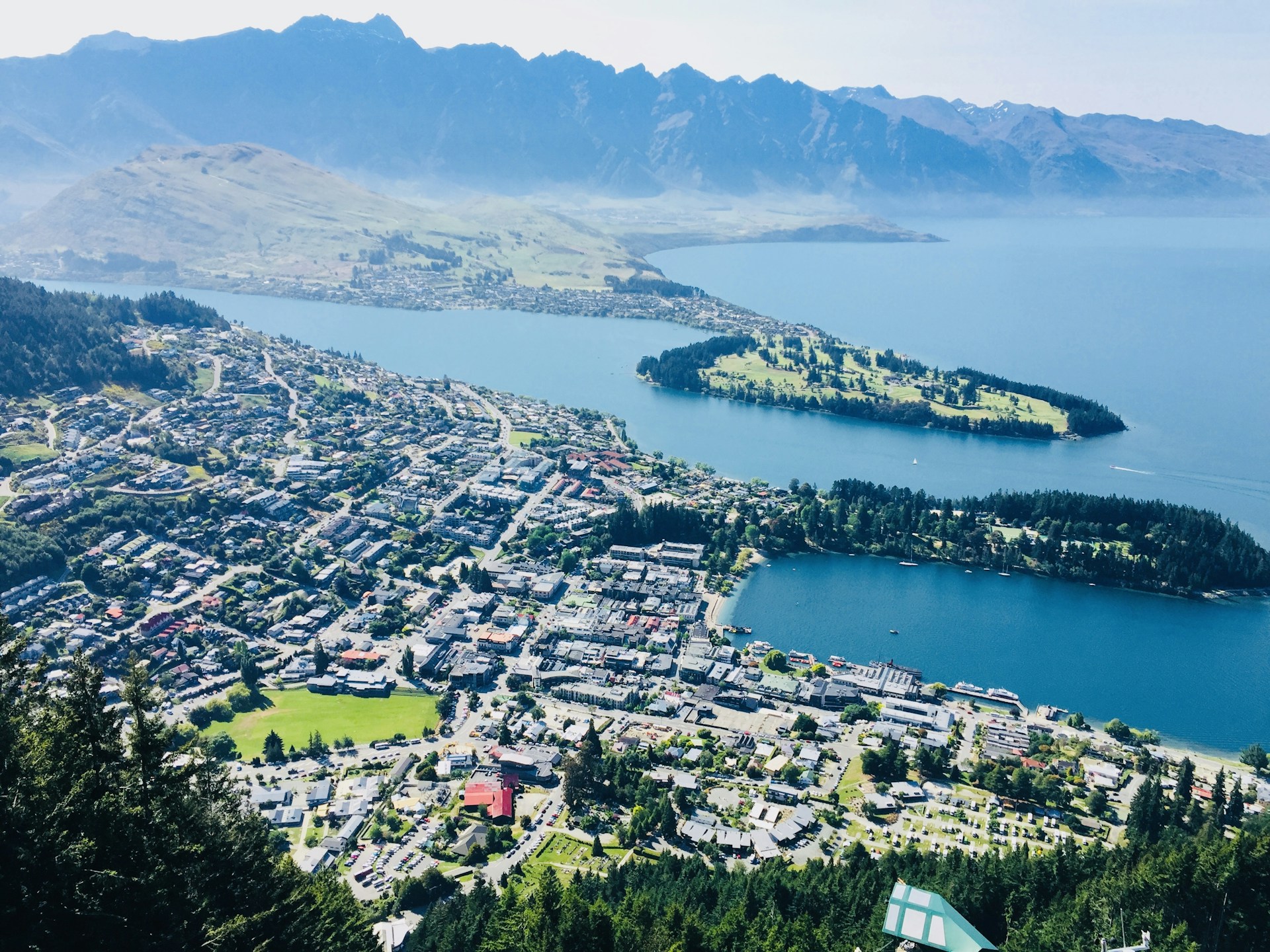 aerial view of city near body of water during daytime