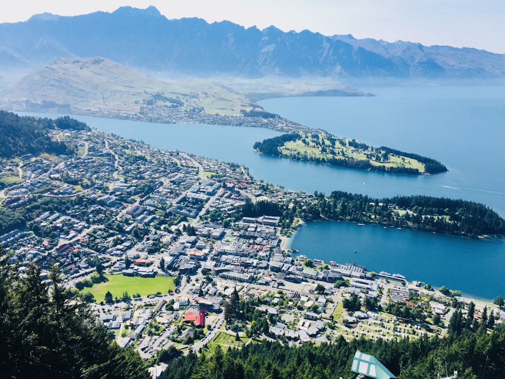 aerial view of city near body of water during daytime