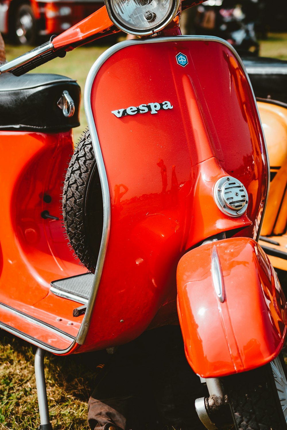 red and silver vespa scooter