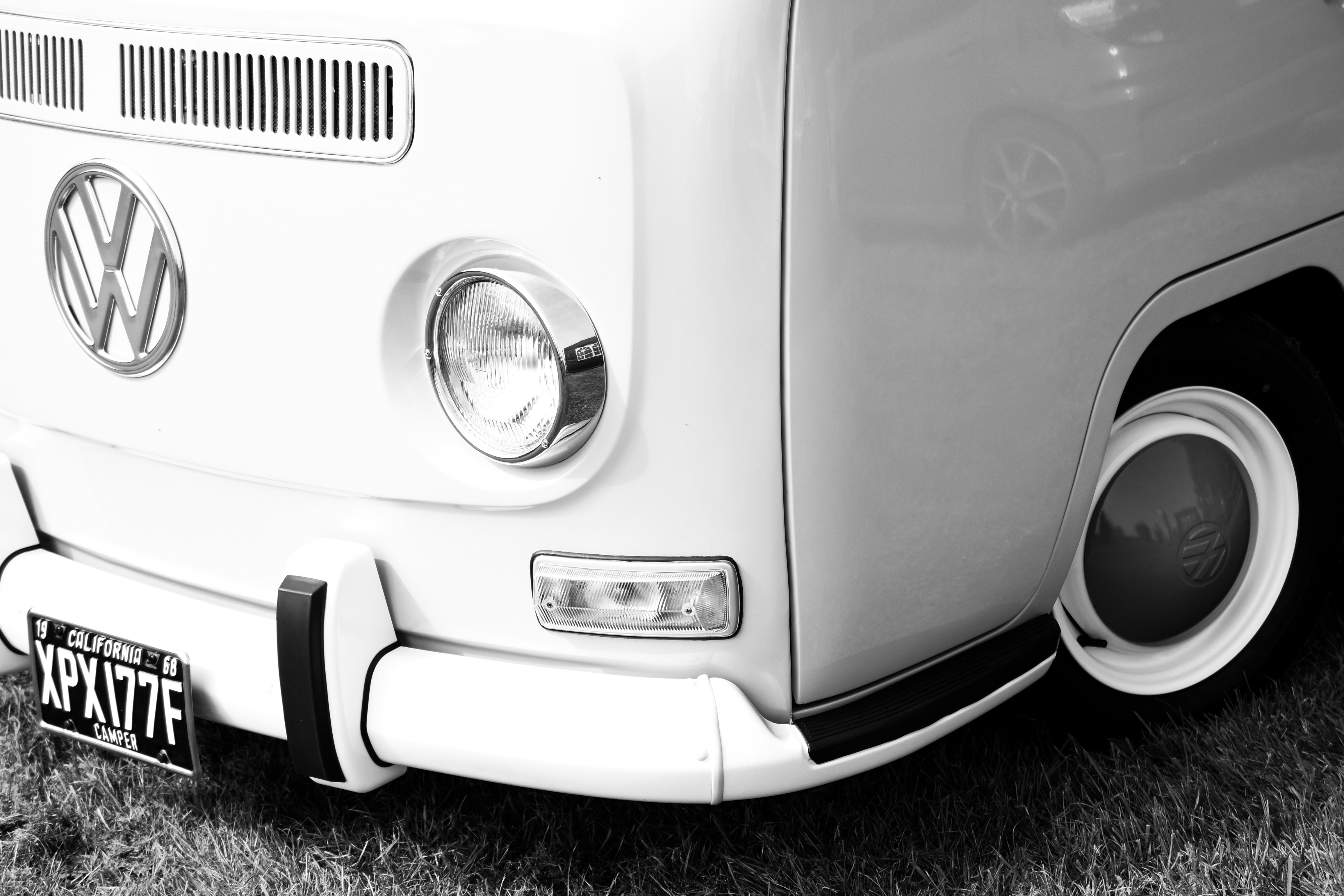White volkswagen beetle on black and white surface photo Free Vehicle